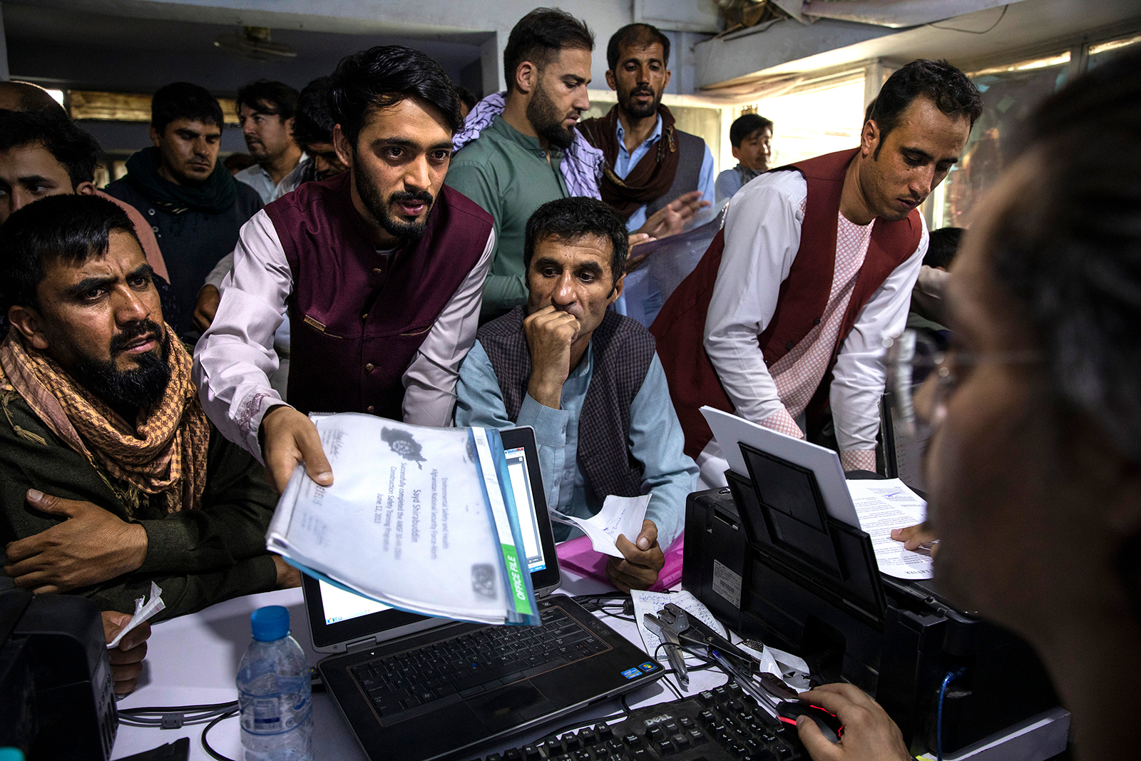 Afghan Special Immigrant Visa applicants crowd into the Herat Kabul Internet cafe seeking help applying for the SIV program on August 8 in Kabul.