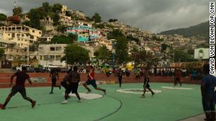 Men playing basketball in Port-au-Prince. Thousands have fled their homes in the capital since June. 
