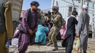 Afghans watch nervously as Taliban regime takes shape, and US and its allies continue frantic exit