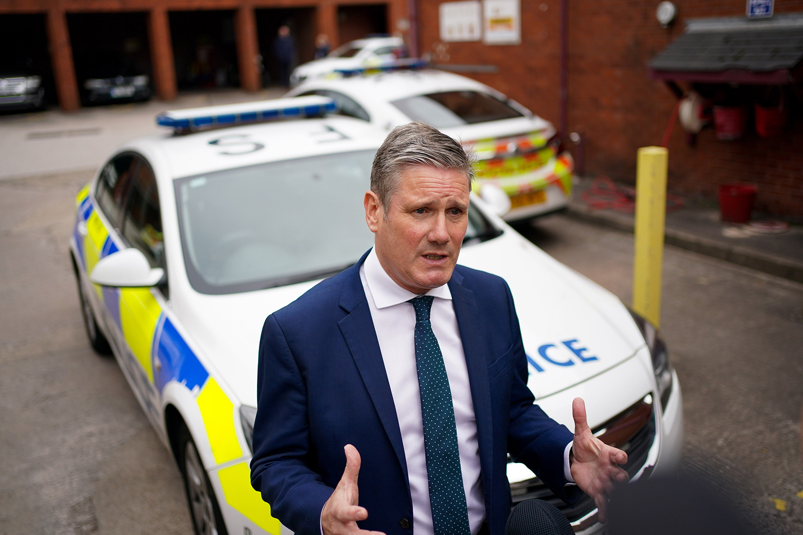 Labour leader Sir Keir Starmer talks to police officers outside Wolverhampton Police Station during a visit to Wolverhampton on Monday. 