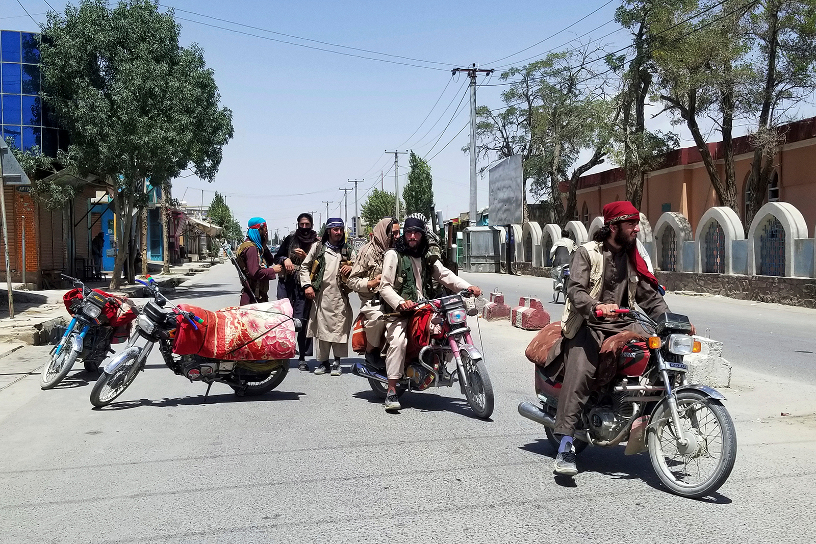 Taliban fighters patrol inside the city of Ghazni, southwest of Kabul, on Thursday.