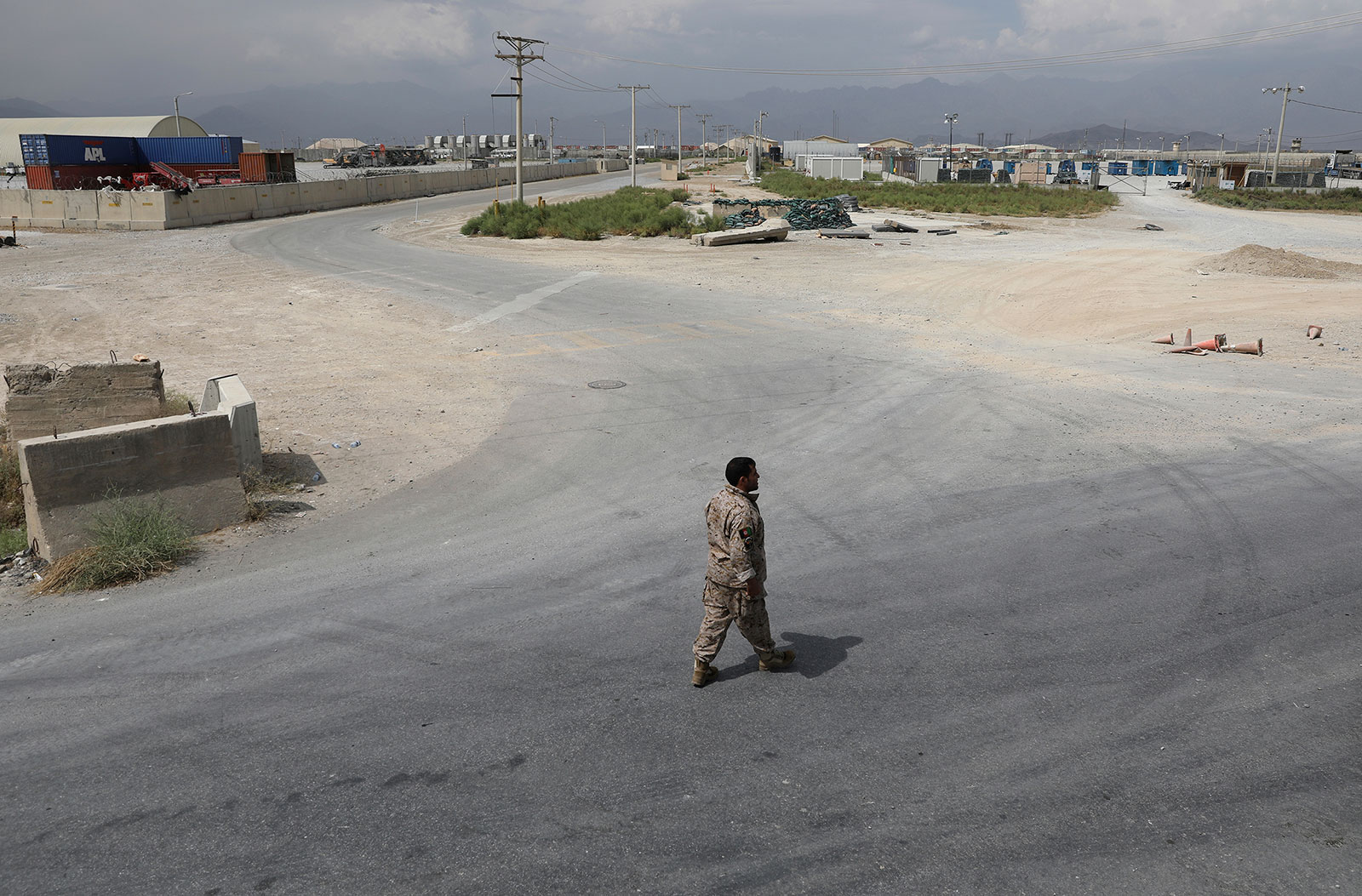 A member of Afghanistan's security forces walks at Bagram Air Base after the last American troops departed the compound in July 2021.