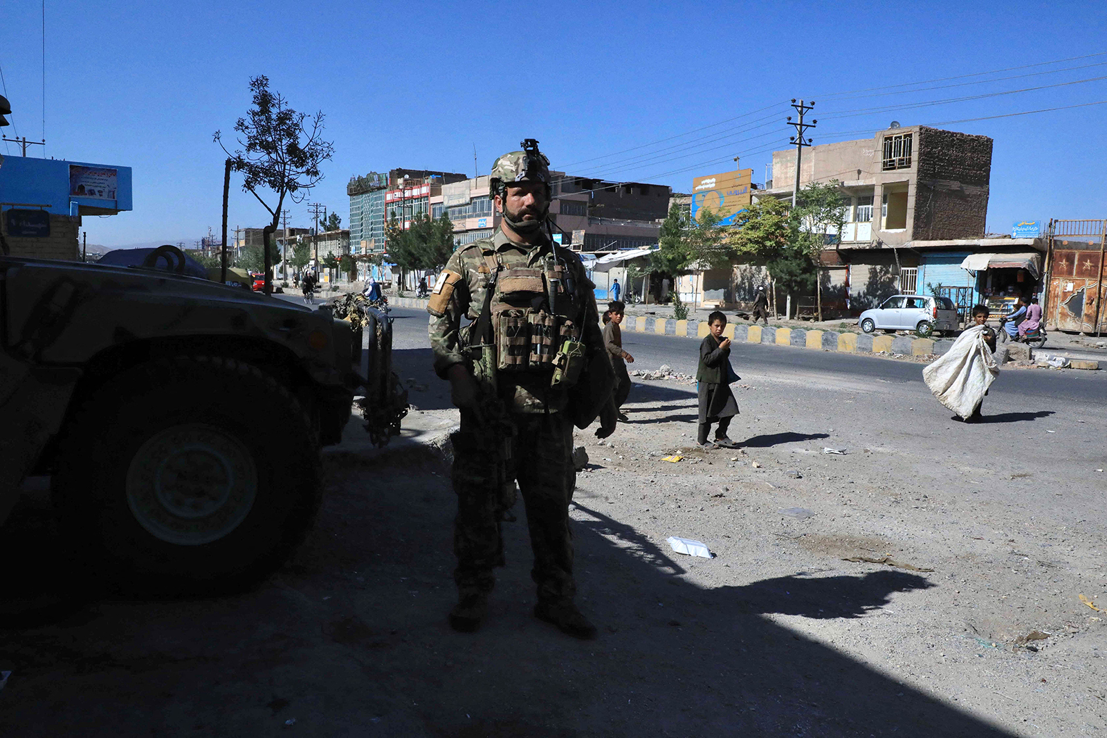  An Afghan security force personnel stands guard along the roadside in Herat on Thursday, as Taliban took over the police headquarters in Herat.