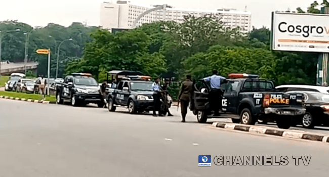 Policemen sighted along the road to the Federal High Court in Abuja on July 26, 2021.